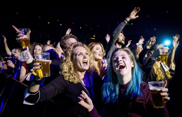 Visitors to the Ziggo Dome attend a performance by Dutch singer Andre Hazes  in Amsterdam on March 7 2021 during a series of trial events in which Fieldlab is investigating how large events can take place safely.