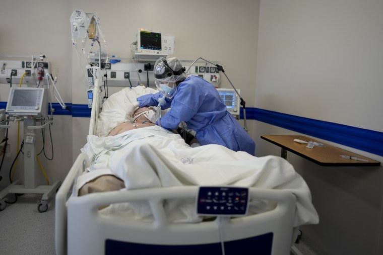 Image: A healthcare worker attends to a Covid-19 patient at the Dr. Norberto Raul Piacentini hospital, in Lomas de Zamora, Argentina, on July 8, 2021.