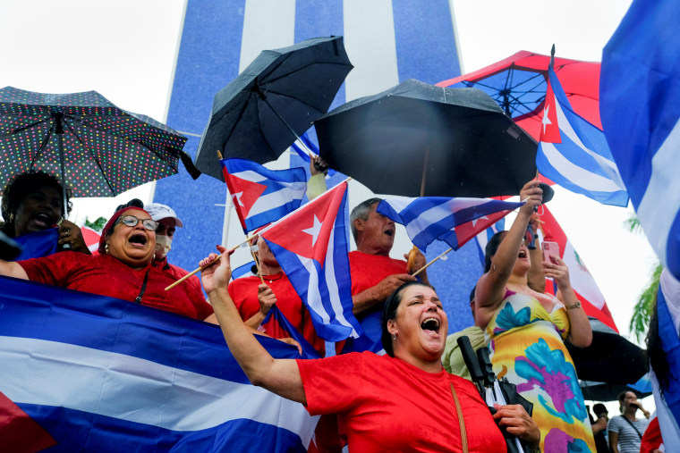 Image: Cuban emigres in the Little Havana neighborhood gather following reports of protests in Cuba against its deteriorating economy, in Miami on July 13, 2021.