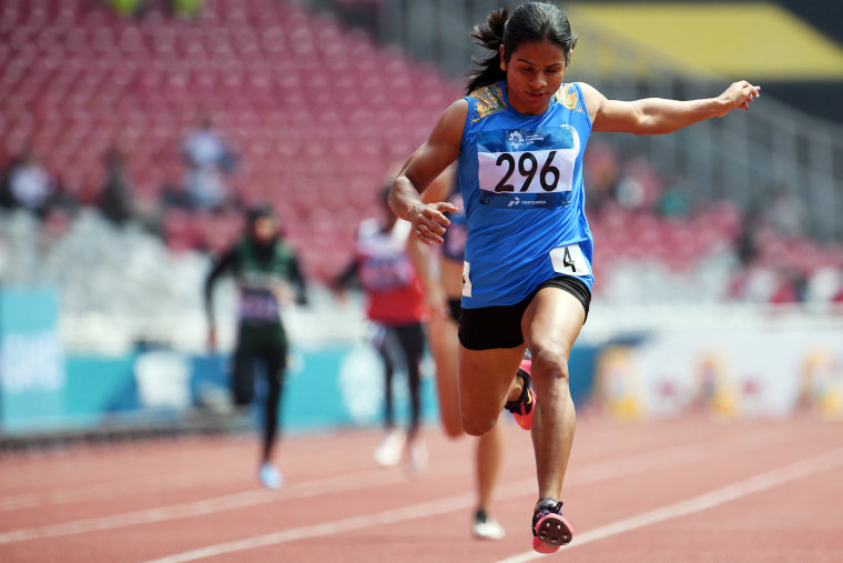 Dutee Chand wins a heat of the women's 200-meter dash during the 2018 Asian Games in Jakarta, Indonesia, on Aug. 28, 2018.