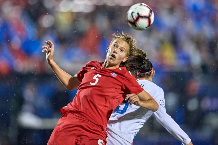 Image: Rebecca Quinn battles for the ball during the final match of the CONCACAF Women's Championship between USA and Canada on Oct. 17, 2018 in Frisco, Texas.