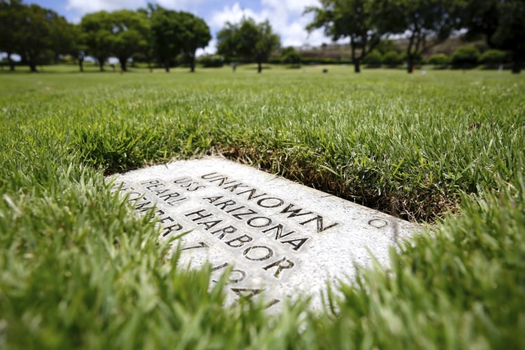 Image: A grave marker for an unknown casualty from the USS Arizona is shown at the National Memorial Cemetery of the Pacific on July 15, 2021 in Honolulu.
