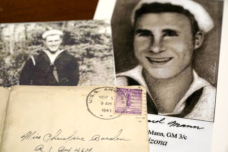 Image: Photos of sailor William Edward Mann and a letter written from him and post-marked from the USS Arizona, where he died during the bombing of Pearl Harbor, at the home of his niece, Teri Mann Whyatt, on July 14, 2021, in Newcastle, Wash.