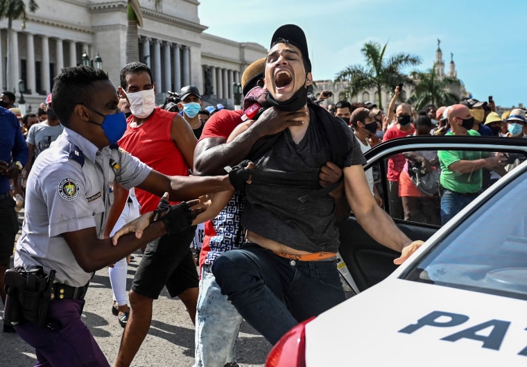 A man is arrested during a demonstration against the government of Cuban President Miguel Diaz-Canel in Havana on July 11, 2021.