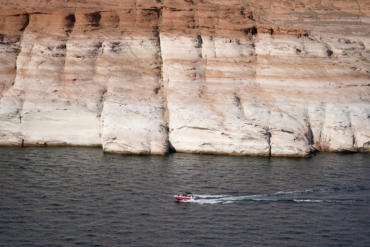 A white band of newly exposed rock is shown along the canyon walls at Lake Powell near Antelope Point Marina on Friday, July 30, 2021.