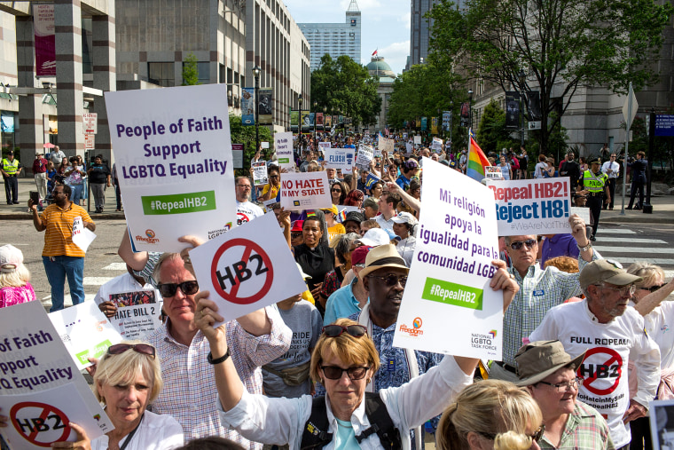 Demonstrators head toward the General Assembly after gathering and calling for the repeal of HB2 in Raleigh, N.C., on April 25, 2016.