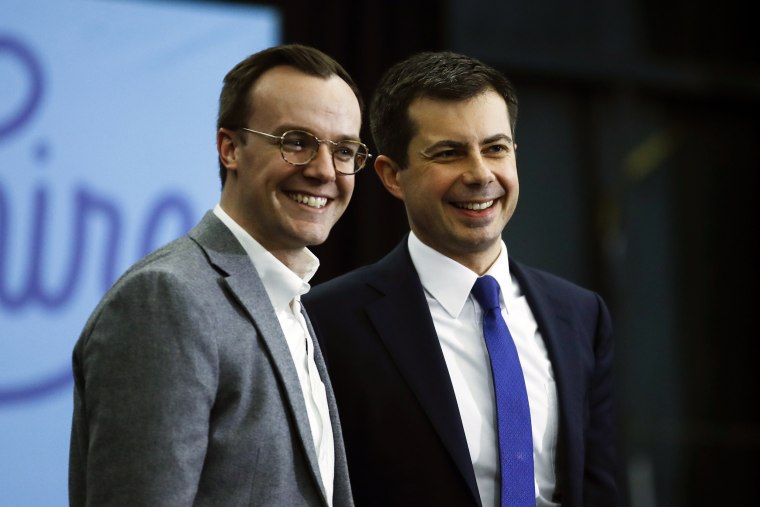 Former South Bend, Ind., Mayor Pete Buttigieg and his husband Chasten Buttigieg acknowledge the audience at the end of a campaign event on Feb. 10, 2020, in Milford, N.H.