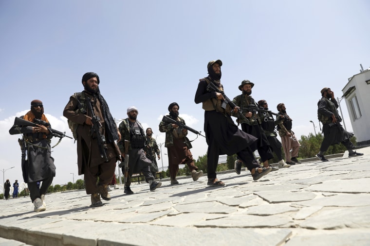 Taliban fighters patrol in Kabul on Aug. 19, 2021.