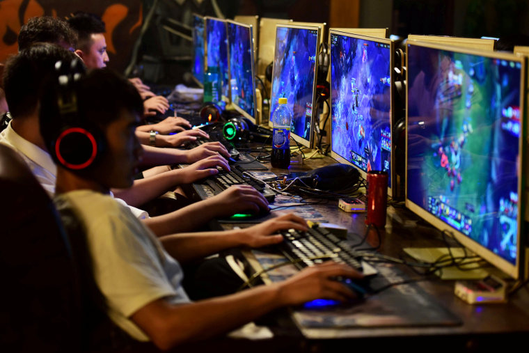 People play online games at an internet cafe in Fuyang, Anhui province, China on Aug. 20, 2018.