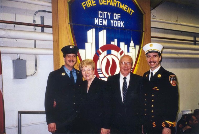 Chief Pfeifer (far right) with his younger brother, Kevin (far left), and their parents.