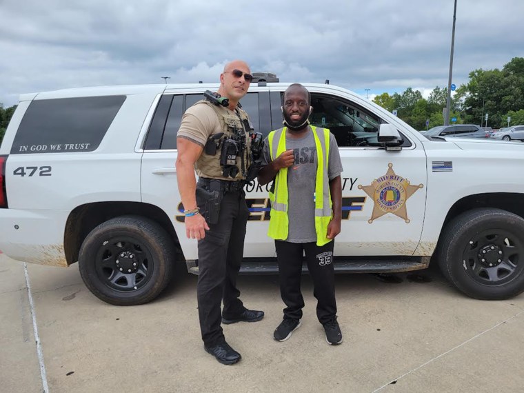 Fields, seen posing with a local fan named Tyler, has worked for the Morgan County Sheriff's Office for 17 years.