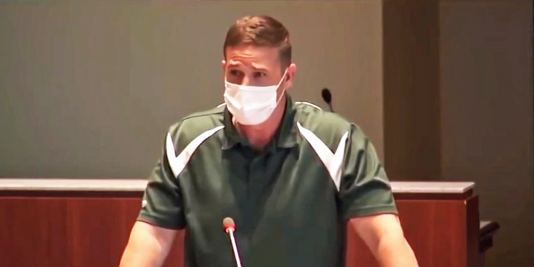 Byron "Tanner" Cross, a physical education teacher at Leesburg Elementary School, speaks at a school board meeting in Loudoun County, Va., in May.