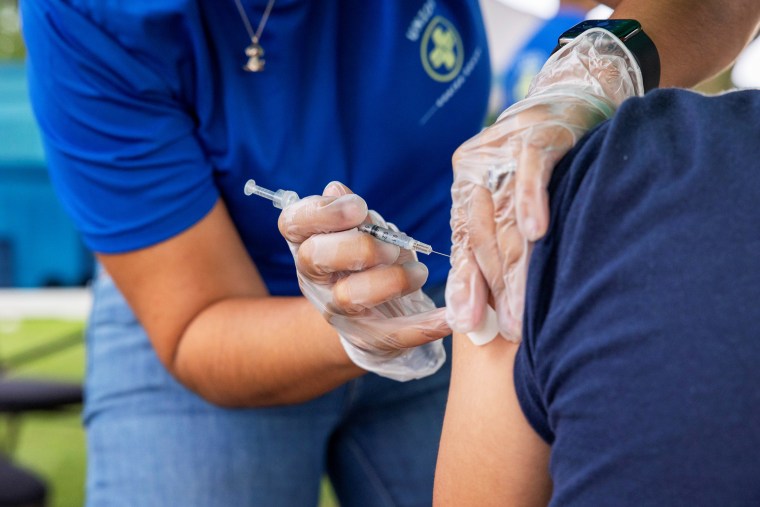 A doctor administers a Covid-19 vaccination in Bensalem, Pa., on Aug. 22, 2021.
