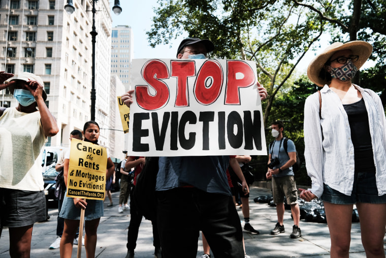 Activists hold a protest against evictions near City Hall on Aug. 11, 2021, in New York.