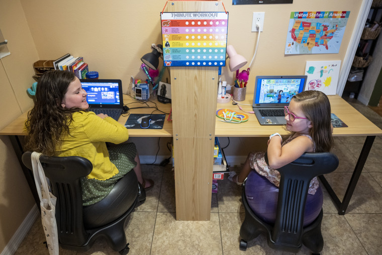 Gracie and Jocelyn use Outschool for online tutoring in their home in St Petersburg, Fla., on Aug. 26, 2021.