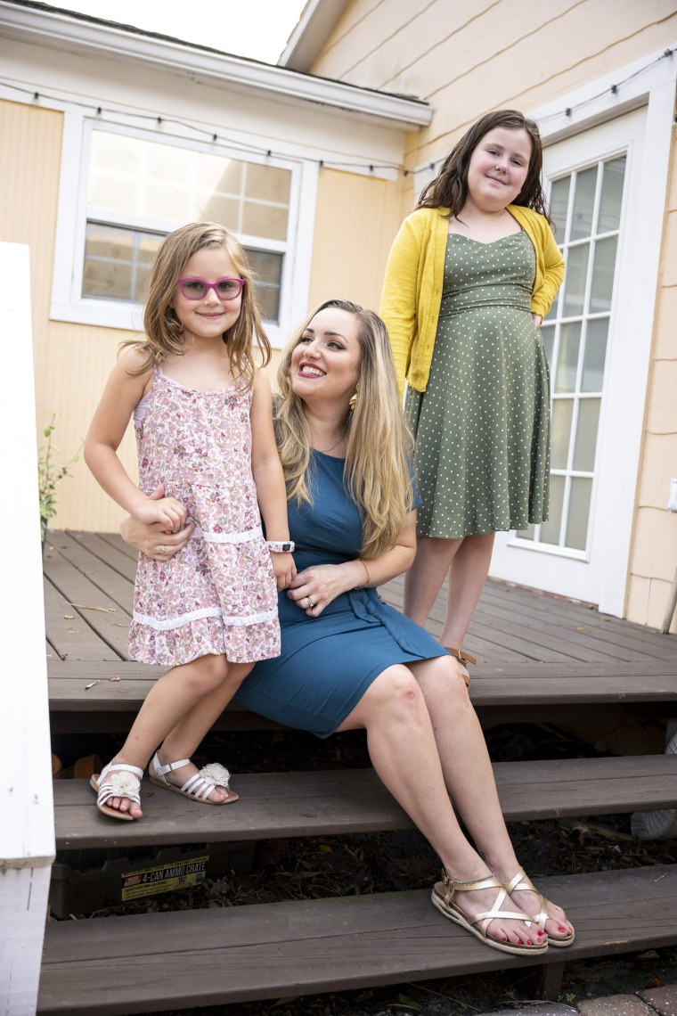 Jasmine Thorn and her daughters Gracie, right, and Jocelyn, left, at their home in St Petersburg, Fla., on Aug. 26, 2021.