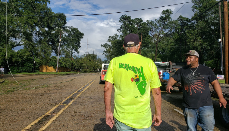 Crew workers with HernandoAg in Baton Rouge, La., cleaning up after Hurricane Ida.