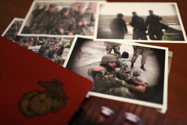 Image: A group of old photos on Mansoor Shams' desk in his Baltimore home show him as a young Marine during his service from 2000-2004.