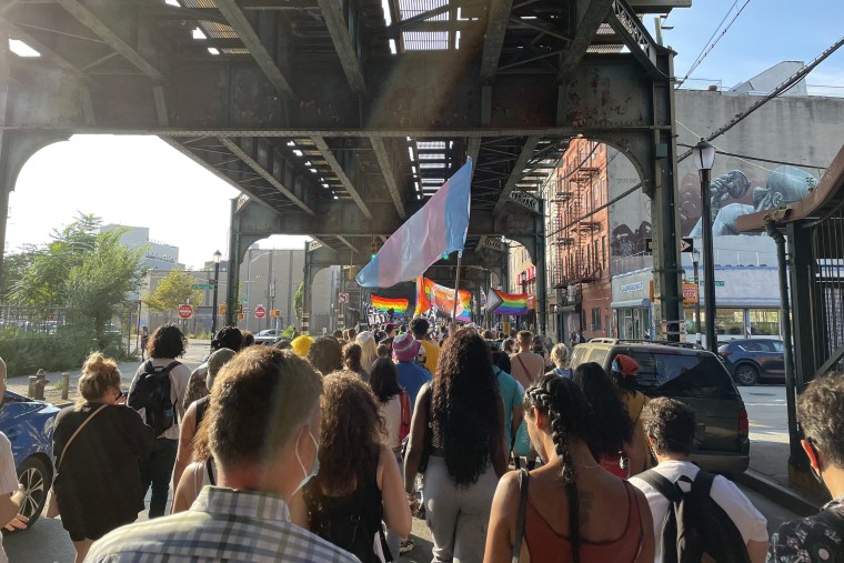 Protesters march in Brooklyn, New York, on Wednesday for two men who police said were stabbed with a glass bottle and a screwdriver.
