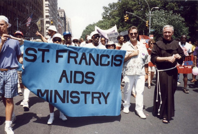 The Rev. Mychal Judge, right, at a Pride march.