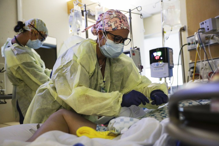 Image: U.S. Army Capt. Corrine Brown, a critical care nurse, administers an anti-viral medication to a Covid-19 patient at Kootenai Health regional medical center in Coeur d'Alene, Idaho, on Sept. 6, 2021.