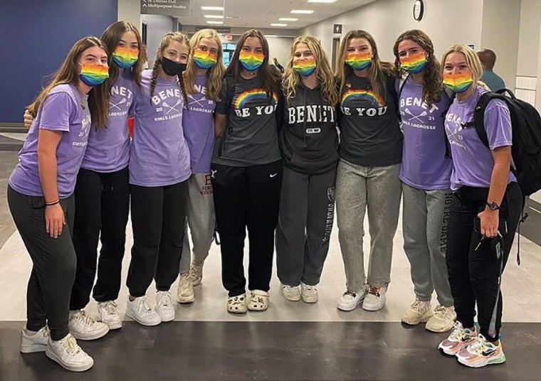 Image: Members of the Benet Academy lacrosse team wear rainbow Pride masks in support of Coach Amanda Kammes.