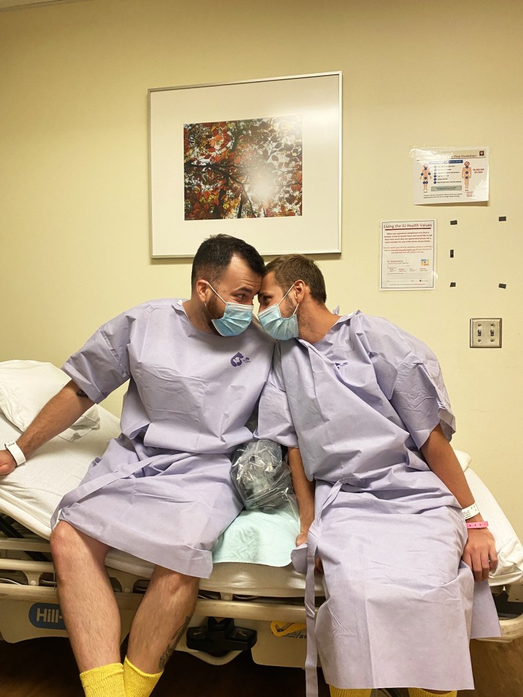 Husbands Rafael Diaz, left, and Reid Alexander share a tender moment together at Indiana University Health Methodist Hospital in Indianapolis on Aug. 13, 2021. Diaz donated one of his kidneys to Alexander.