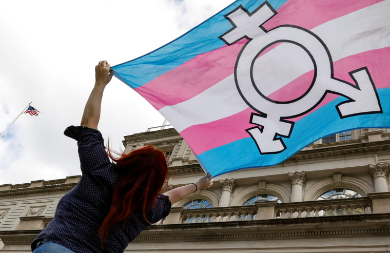 Image: A person holds up a flag during a rally in New York City on Oct. 24, 2018.