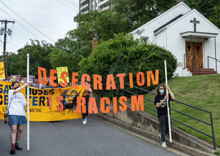 Image: Supporters of the Moses African Cemetery in Bethesda, Md., march past the Macedonia Baptist Church on Sept. 10, 2021, in protest of a planned sale of the land.
