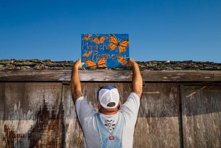 A Monarch Preserve sign is mounted onto a shed at the ranch.