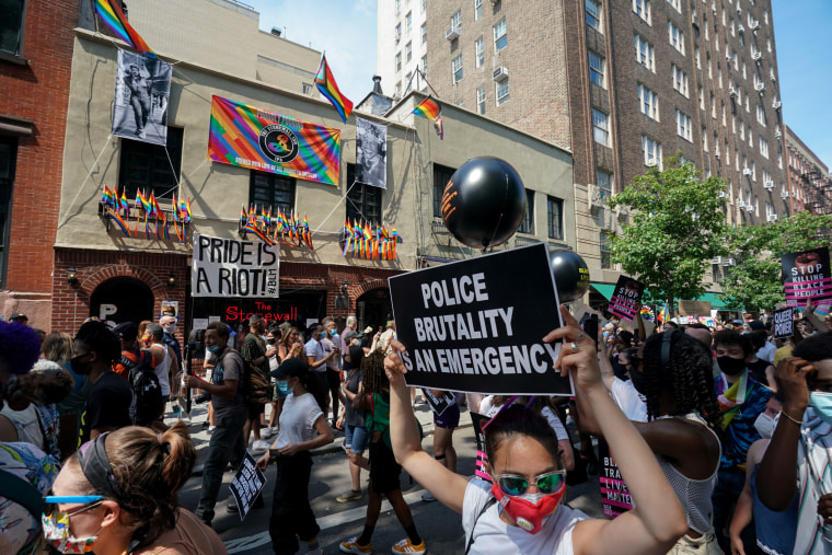 Image: Protesters walk past the Stonewall Inn during a Queer Liberation March in New York June 28, 2020.