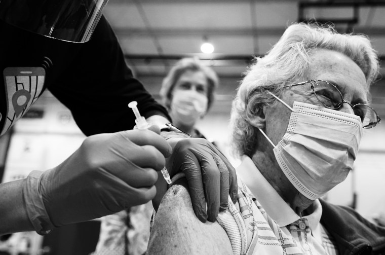 Image: A woman receives a Covid-19 vaccine in Martinsburg, W.V., on March 11, 2021.