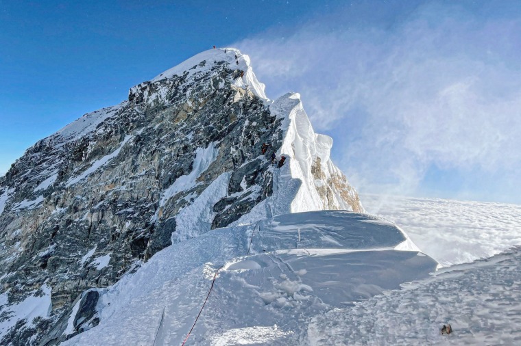 Mountaineers climb the Hillary Step on their way to the summit of Mount Everest on May 31, 2021.