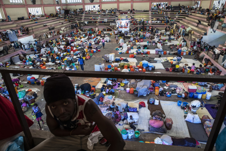 Internally displaced people due to gang violence take shelter in the Center Sportif of Carrefour in Port-au-Prince, Haiti, on Sept. 18, 2021.