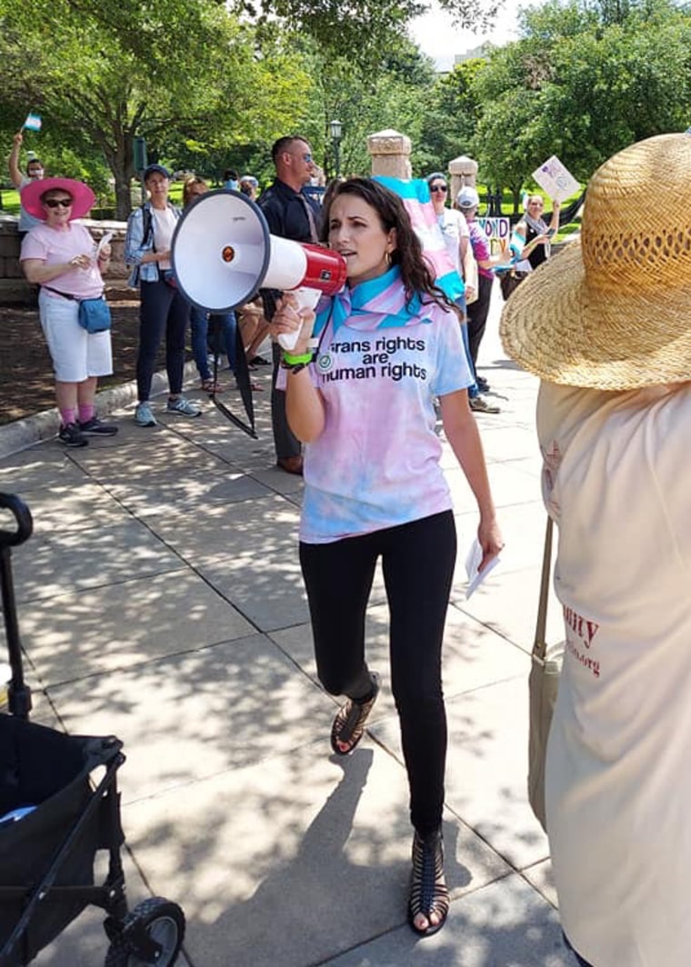 Image: Annaliese Cothron protests on behalf of her 8-year-old nonbinary child.