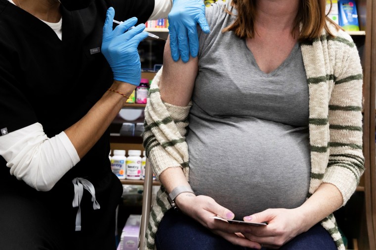A pregnant woman receives a Covid-19 vaccination at Skippack Pharmacy in Schwenksville, Pa., on Feb. 11, 2021.