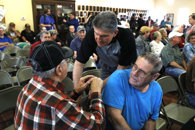 Sen. Joe Manchin, D-W.Va., talks with constituents before holding a town hall meeting with coal miners on March 31, 2017, in Matewan.