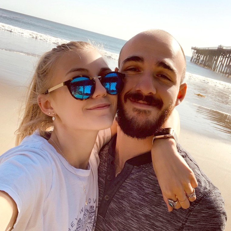 Laundrie and Petito pose on a beach.