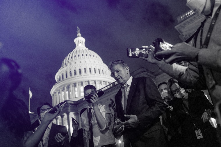 Image: Sen. Joe Manchin, D-W.Va., speaks to reporters after meeting with Sen. Kyrsten Sinema, D-Ariz., and other White House officials about the economic agenda at the Capitol on Sept. 30, 2021.