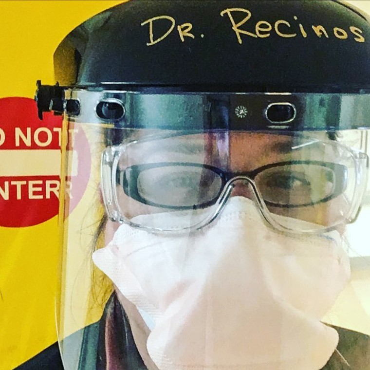 Dr. Sheryl Recinos, seen in March 2020, wearing homemade personal protective equipment fashioned from a welding hat. When the pandemic first began, PPE was scarce, a source of fear and stress for health care professionals.