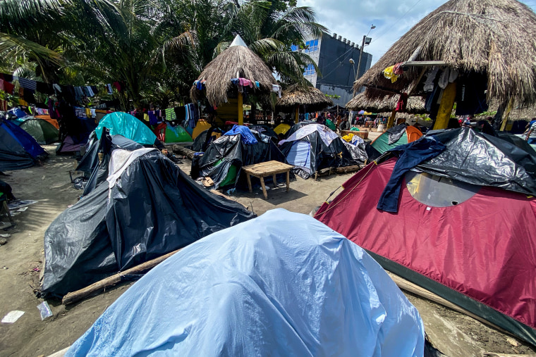 Some 20,000 migrants are believed to be in the Colombian beach town of Necoclí .