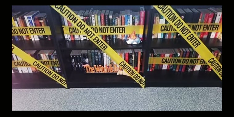 Image: A Carroll ISD teacher hung caution tape in front of the books in a classroom after the new policy was circulated.