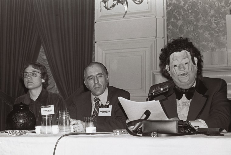 Disguised as "Dr. H. Anonymous" in an oversized tuxedo and distorted Nixon mask, Dr. John Fryer sent shock waves through the American Psychiatric 
Association's 1972 convention by describing his life as a closeted gay psychiatrist.