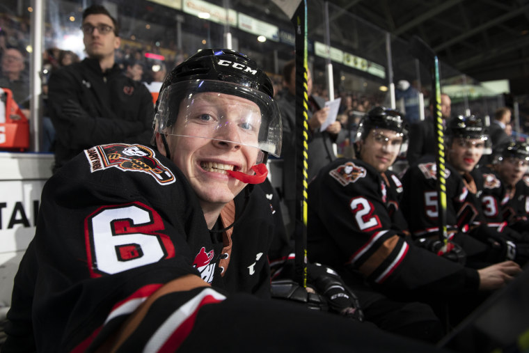 Luke Prokop of the Calgary Hitmen sits on the bench during third period against the Kelowna Rockets on Feb. 17, 2020, in Kelowna, Canada.