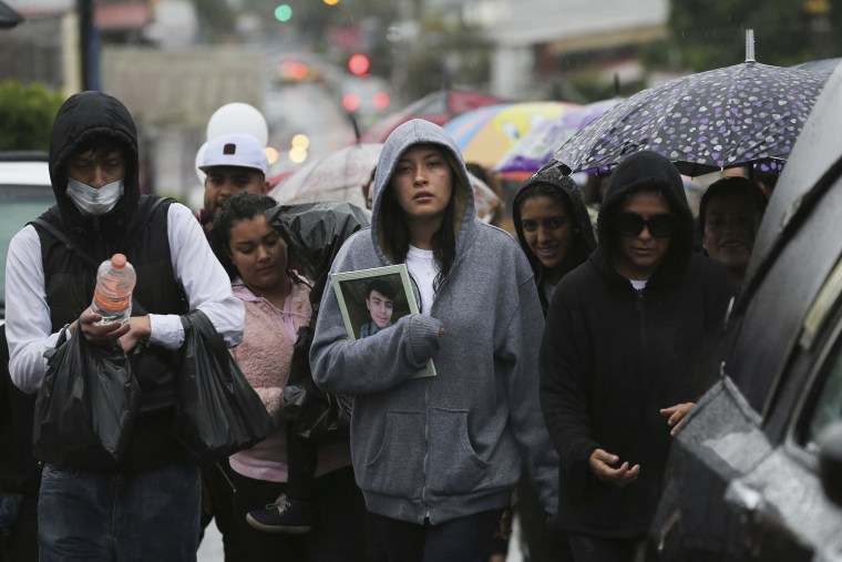 Family and friends at the funeral procession for one of the victims of a shooting at a video game arcade in Uruapan, Mexico, on Feb. 5, 2020.  