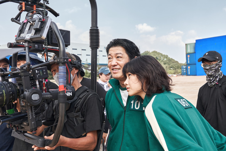 Jung Ho-yeon, right, behind the scenes during the filming of "Squid Game" on Netflix.