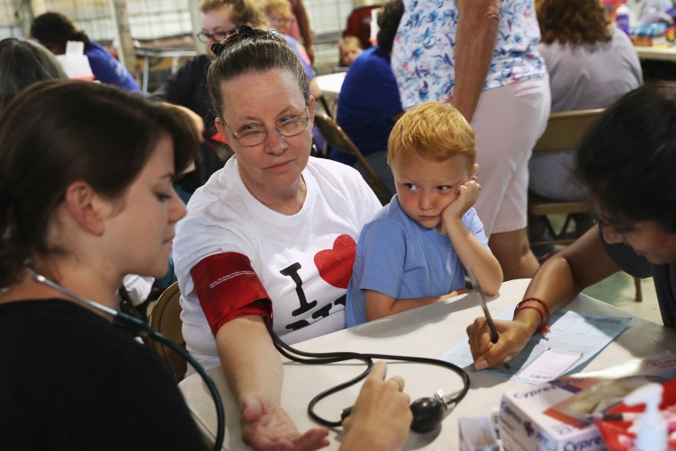 Image: Ruby Partin, 63, and her adoptive son Timothy Huff, 5, visit the free annual Remote Area Medical health clinic on July 22, 2017 in Wise, Va.