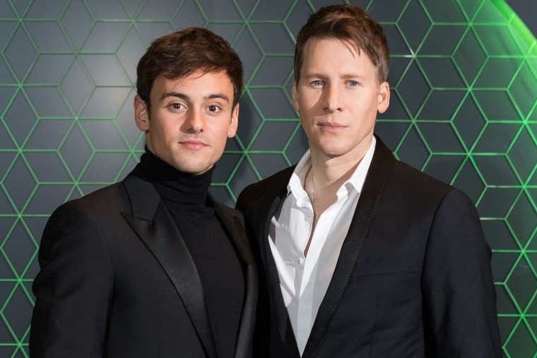 Image: Tom Daley and Dustin Lance Black at the Vanity Fair x Bloomberg climate change gala dinner in London on Dec. 11, 2018.