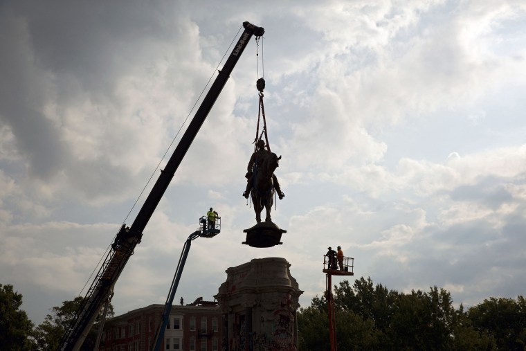 Image:  The statue of Confederate General Robert E. Lee is removed from Monument Avenue in Richmond, Va., on Sept 8, 2021.