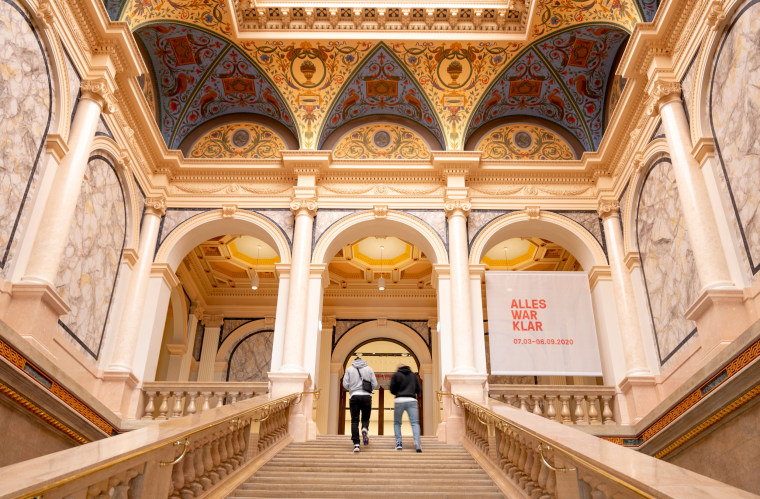 Visitors arrive at the reopened Albertina Modern art museum featuring the exhibition "The Beginning" in Vienna on May 27, 2020.